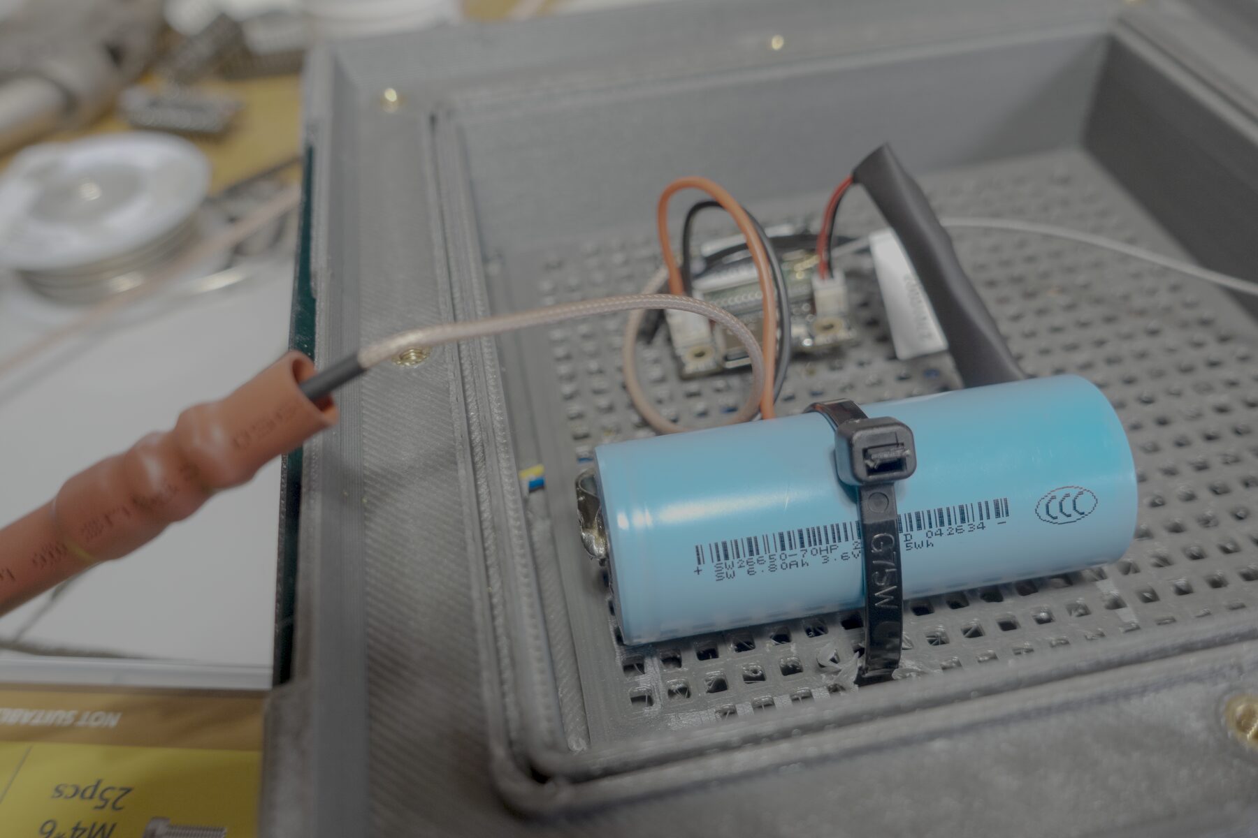 Antenna cable and battery wiring inside the lantern node enclosure.